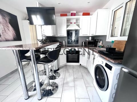 Kitchen or kitchenette, Dining area, oven, stove, washing machine, dryer