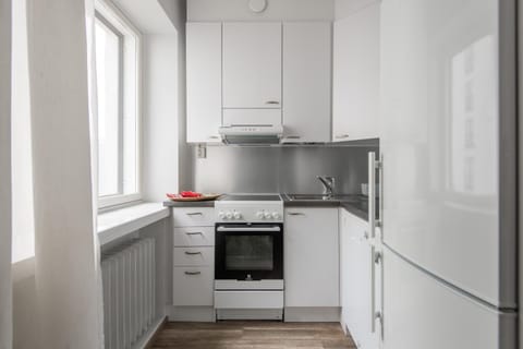 Kitchen or kitchenette, dishwasher, oven, stove