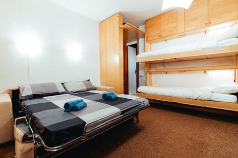 Photo of the whole room, bunk bed, towels, wardrobe