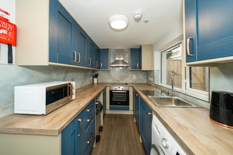 Kitchen or kitchenette, dishwasher, oven, stove, toaster