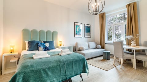 Bed, Living room, Seating area, Bedroom