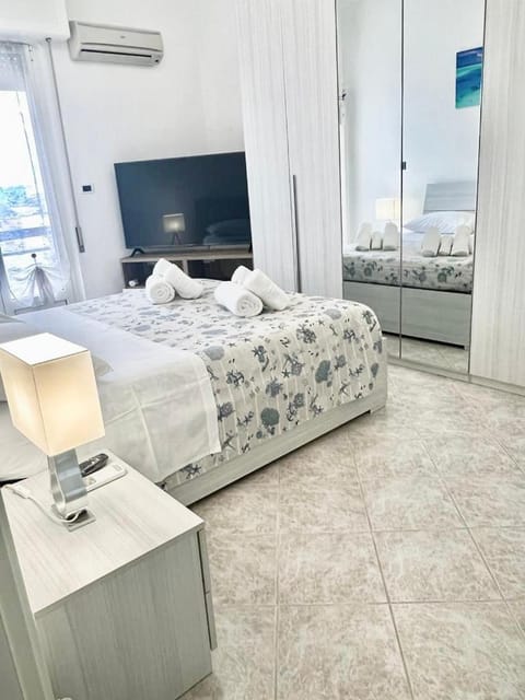 Bed, TV and multimedia, Bedroom, towels, wardrobe, air conditioner