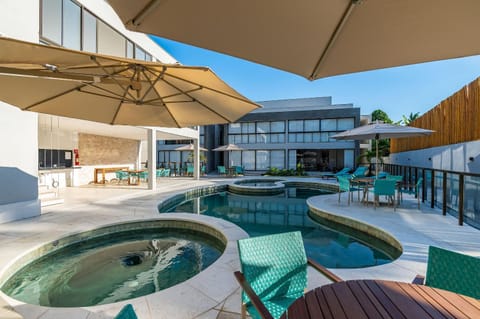 Property building, Patio, Day, Natural landscape, Pool view, Swimming pool, sunbed