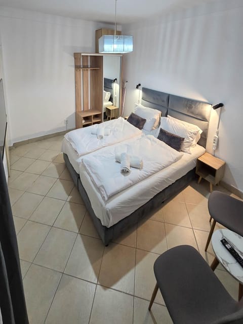 Bed, Photo of the whole room, Bedroom, towels, air conditioner