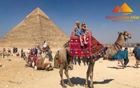 Nearby landmark, Day, People, Animals, Text overlay, Landmark view, group of guests