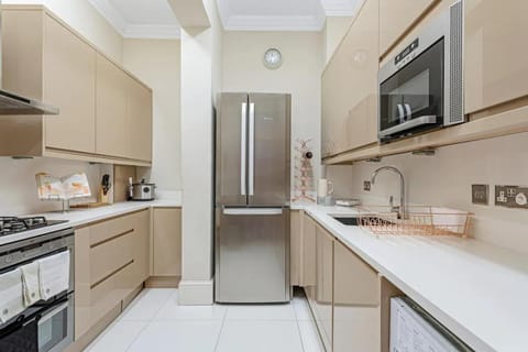Kitchen or kitchenette, dishwasher, oven, stove, toaster