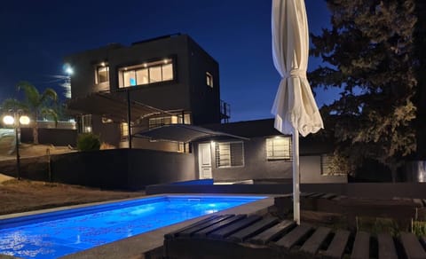 Property building, Patio, Night, Pool view, Swimming pool, sunbed