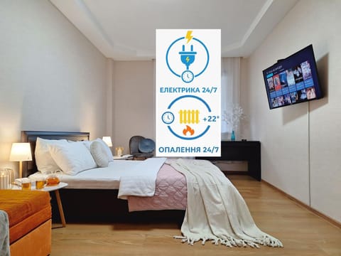 Communal lounge/ TV room, Bed, Property logo or sign, TV and multimedia, Photo of the whole room, Evening entertainment, Logo/Certificate/Sign, Bedroom, Text overlay, Certificate/Award, internet, internet, internet, towels