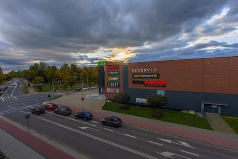 Property building, Day, Neighbourhood, Street view, Shopping Area, Location, Sunset