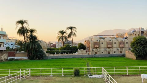 Property building, Nearby landmark, Spring, Day, Natural landscape, Landmark view, Mountain view