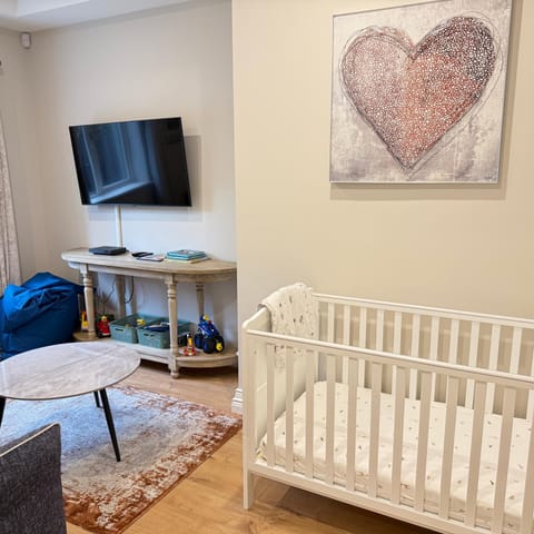 Communal lounge/ TV room, cot