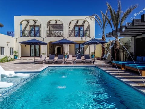 Property building, Patio, Pool view, Swimming pool, sunbed