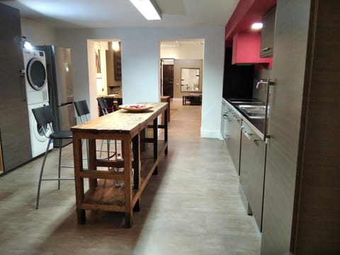 Kitchen or kitchenette, dishwasher, oven, stove