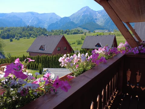 Property building, Nearby landmark, Spring, Day, Natural landscape, Garden, View (from property/room), Balcony/Terrace, Garden view, Mountain view