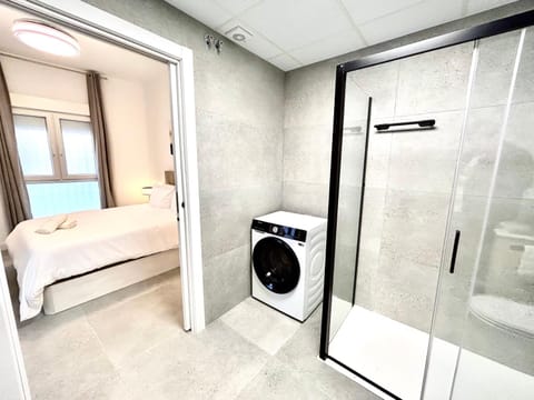 Shower, Bed, Bathroom, Bedroom, towels, washing machine, dryer