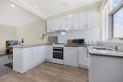 Kitchen or kitchenette, dishwasher, oven, stove, toaster