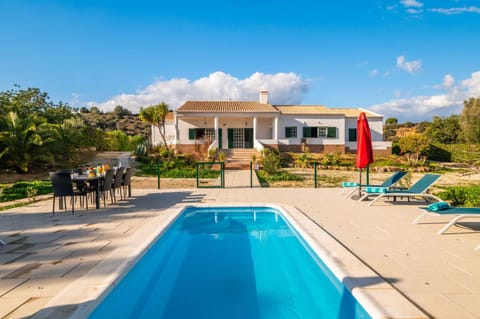 Property building, Patio, Garden, Swimming pool, sunbed