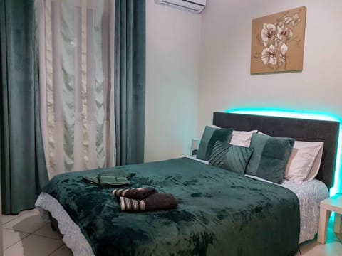 Bed, Photo of the whole room, Bedroom, towels, air conditioner