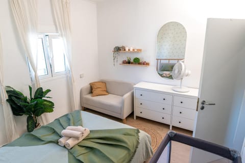 Bed, Photo of the whole room, Seating area, Bedroom, cot, towels, wardrobe