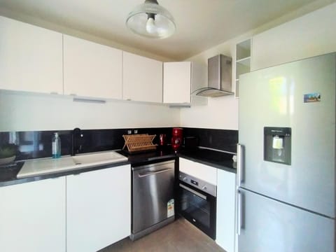 Kitchen or kitchenette, dishwasher, oven, stove, toaster