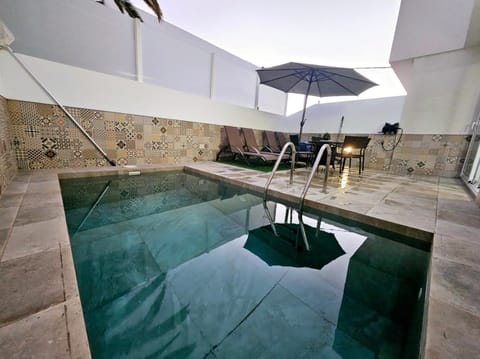 Patio, Off site, Pool view, Swimming pool, sunbed