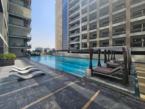 Property building, Day, Pool view, Swimming pool, sunbed