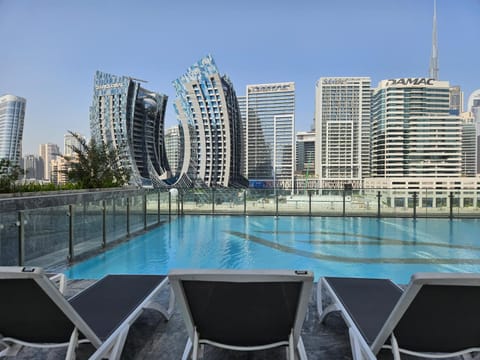 Property building, Day, City view, Pool view, Swimming pool, Swimming pool, sunbed