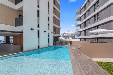 Property building, Day, Pool view, Swimming pool, sunbed