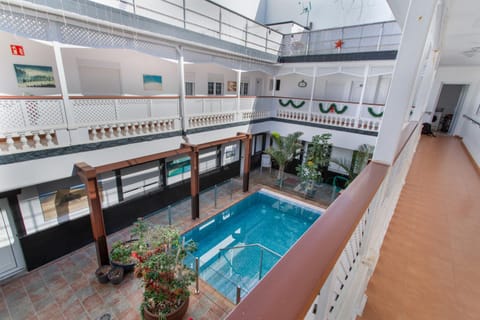 Property building, Living room, Swimming pool