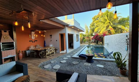 Property building, Patio, Day, Garden, View (from property/room), Balcony/Terrace, Living room, Seating area, Dining area, Garden view, Swimming pool, Dinner