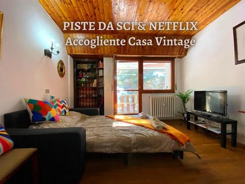 Communal lounge/ TV room, Bed, Property logo or sign, TV and multimedia, Evening entertainment, Text overlay