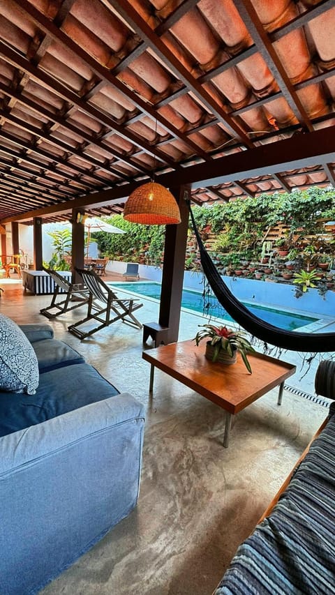 Patio, Living room, Seating area, Pool view, Swimming pool