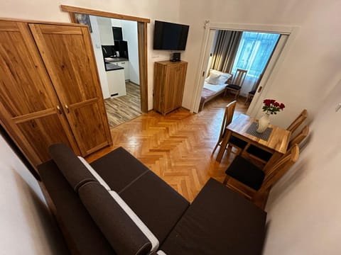 Bed, Living room, Seating area, Dining area