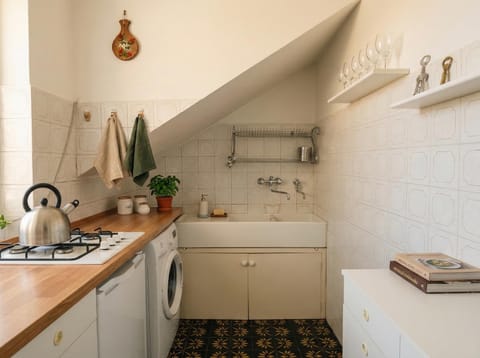 Kitchen or kitchenette, stove, washing machine