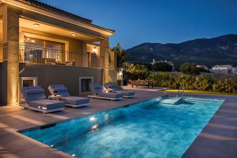 Property building, Patio, Night, Natural landscape, Mountain view, Pool view, Swimming pool, sunbed