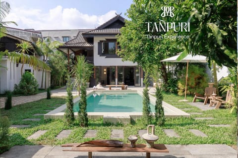 Property building, Patio, Communal lounge/ TV room, Spring, Day, Natural landscape, Garden, Text overlay, Garden view, Pool view, Swimming pool, sunbed