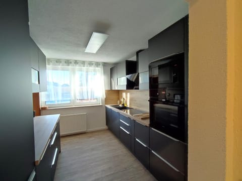 Kitchen or kitchenette, oven, stove
