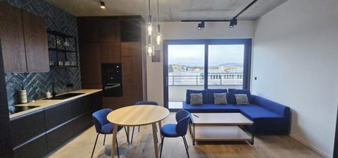 Property building, Balcony/Terrace, Balcony/Terrace, Kitchen or kitchenette, Living room, microwave, oven, stove, stove, kitchen, kitchen