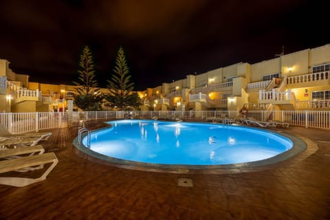 Property building, Patio, Night, Pool view, Swimming pool, sunbed