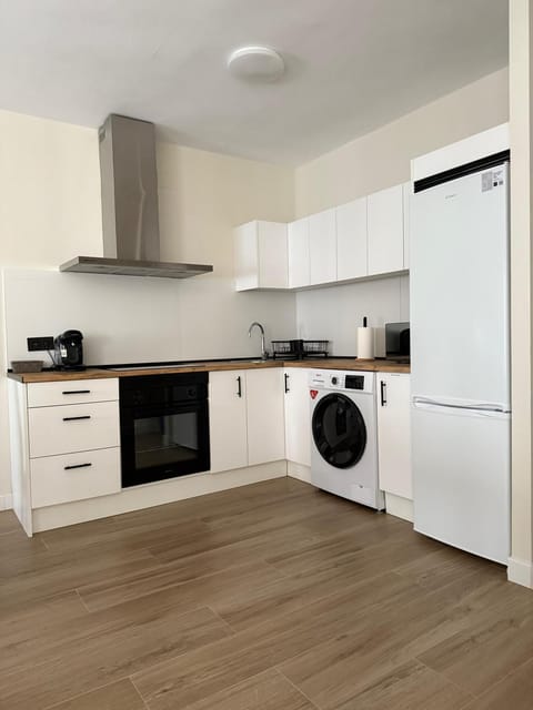 Kitchen or kitchenette, microwave, oven, washing machine