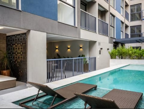 Property building, Pool view, Swimming pool, sunbed
