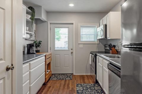 Kitchen or kitchenette, dishwasher, microwave, oven, stove