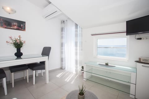 TV and multimedia, View (from property/room), Living room, Seating area, Sea view