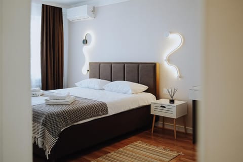 Bed, Photo of the whole room, Bedroom, towels, air conditioner