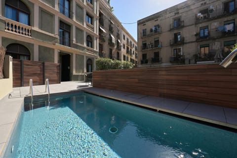 Property building, Day, Pool view, Swimming pool, sunbed