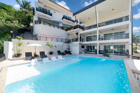 Property building, Patio, Facade/entrance, Day, Pool view, Swimming pool
