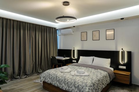 Bed, Photo of the whole room, Bedroom, towels, air conditioner