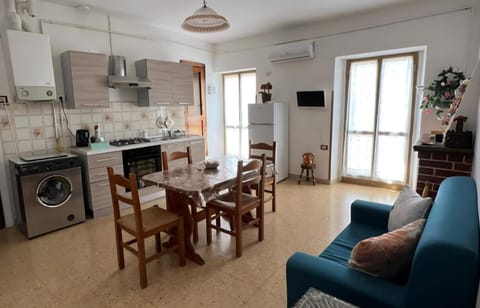 TV and multimedia, Kitchen or kitchenette, Living room, Dining area, fireplace, oven, stove, washing machine, air conditioner