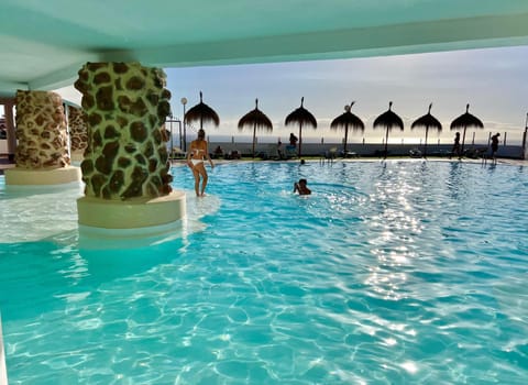 Day, People, Natural landscape, Pool view, Swimming pool, sunbed