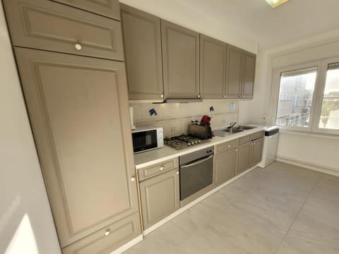 Kitchen or kitchenette, dishwasher, oven, stove, toaster